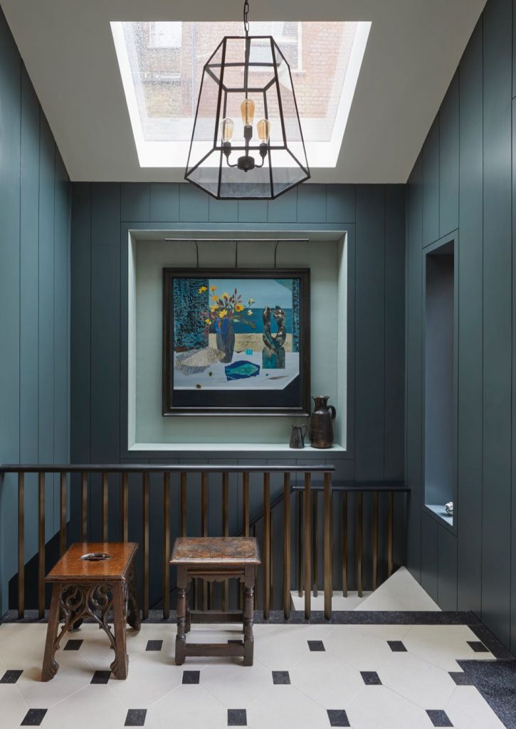 London house hall with tongue and groove painted walls, leather handrails by Bill Amberg, skylight and art by Marzia Colonna