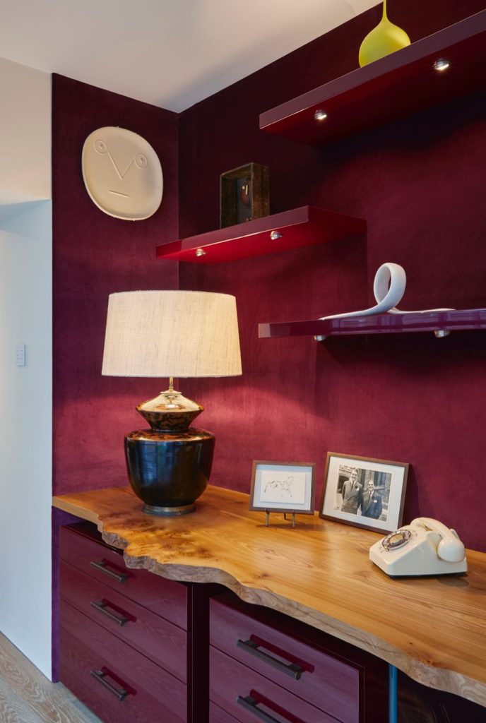 Live edge desk with plum velvet walls