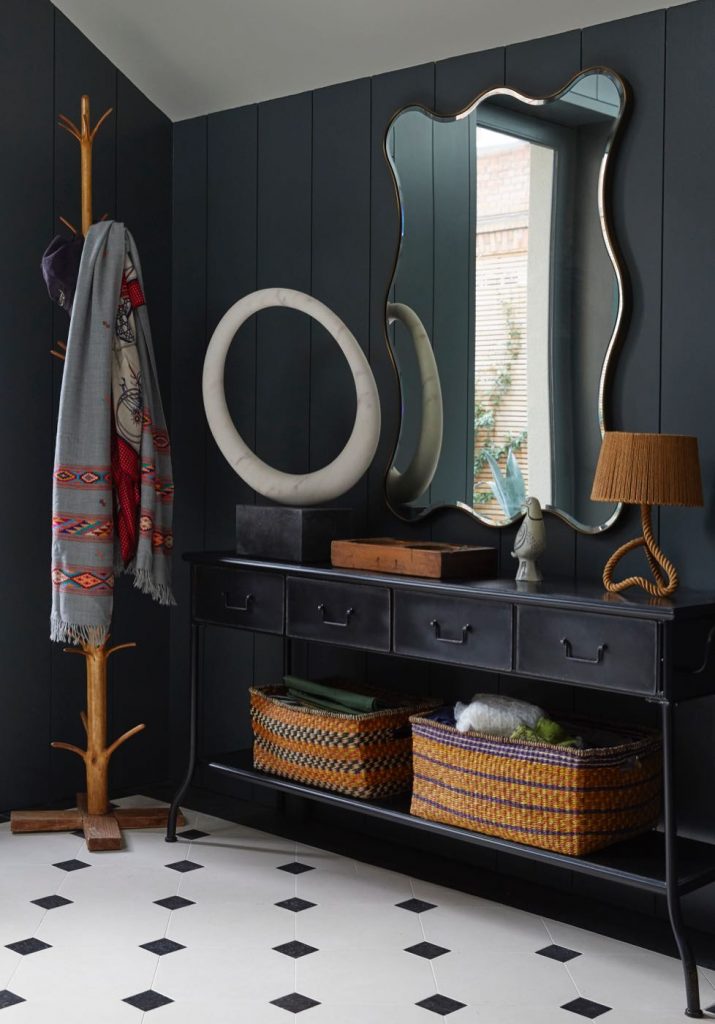 London hallway with Julian Chichester swirl mirror, console table, rope lamp and hatstand